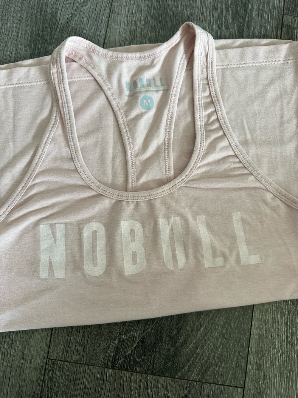 NOBULL Pale Pink Racerback Tank with White Logo